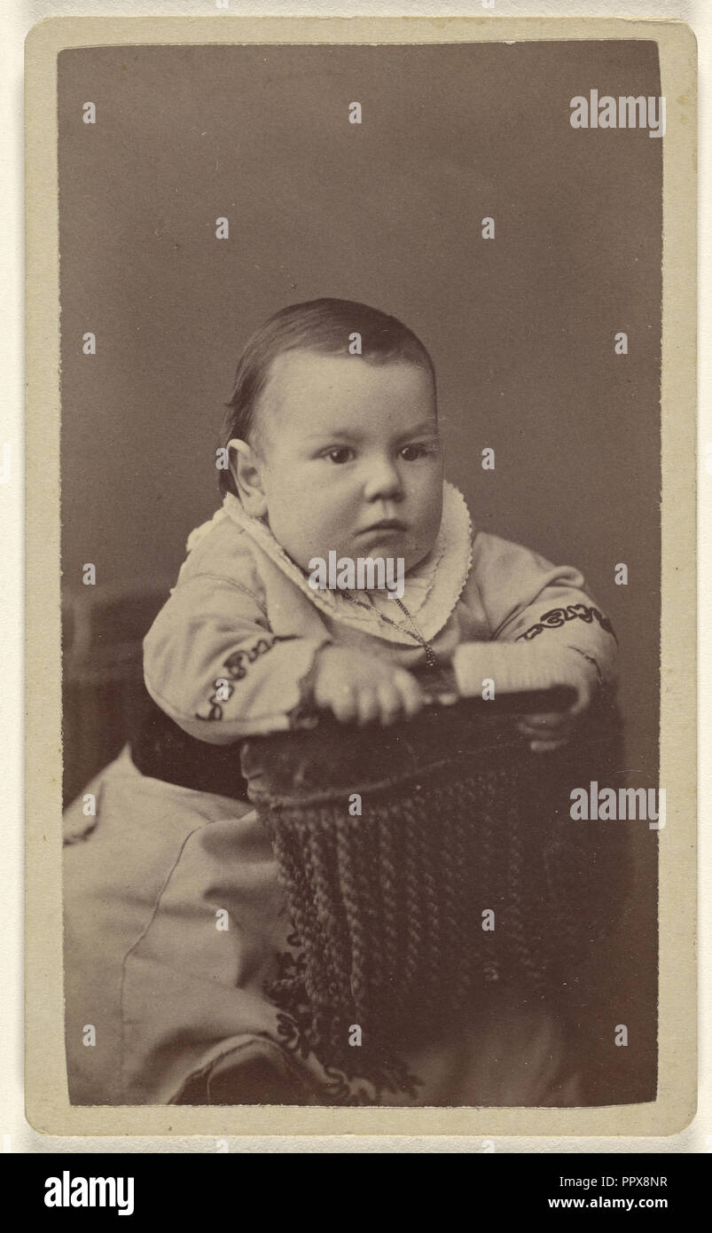 Baby posed in chair; Alexander Hesler, American, born Canada, 1823 - 1895, 1870s; Albumen silver print Stock Photo