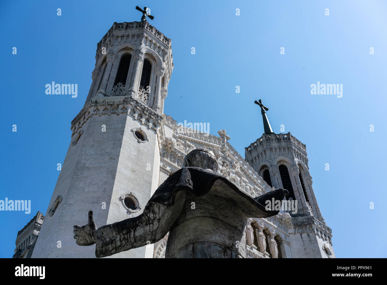Notre-dame de Fourviere basilica facade view and back of Jean-Paul II statue in Lyon France Stock Photo