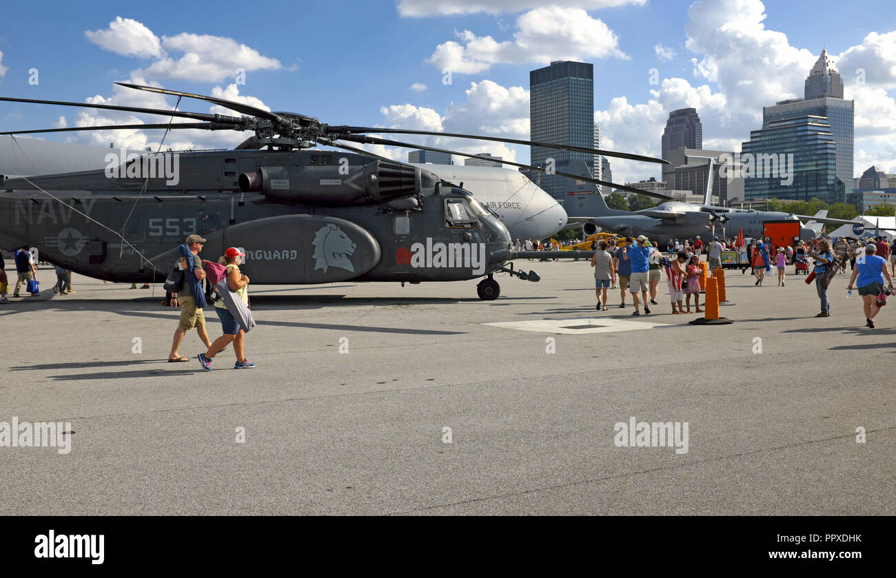 2018 Cleveland National Air Show attendees walk past a Navy MH-53 Helicopter as they make their way to the exit at the end of the show in Cleveland. Stock Photo