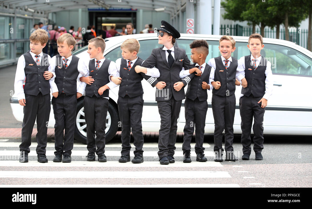 Children of easyJet staff recreate a famous scene from Hollywood blockbuster Catch Me If You Can at London Southend Airport to mark the launch of a national campaign to inspire more girls to become airline pilots. Leading the cast is 9-year-old Hannah Revie, daughter of easyJet captain Emily Revie, playing the central role portrayed by Leonardo DiCaprio in the 2002 film. By re-shooting the movie scene, easyJet wants to correct misconceptions forwarded by Hollywood movies like Top Gun, The Aviator and Flyboys that being a pilot is a man’s job. Research by the airline reveals that more than half Stock Photo