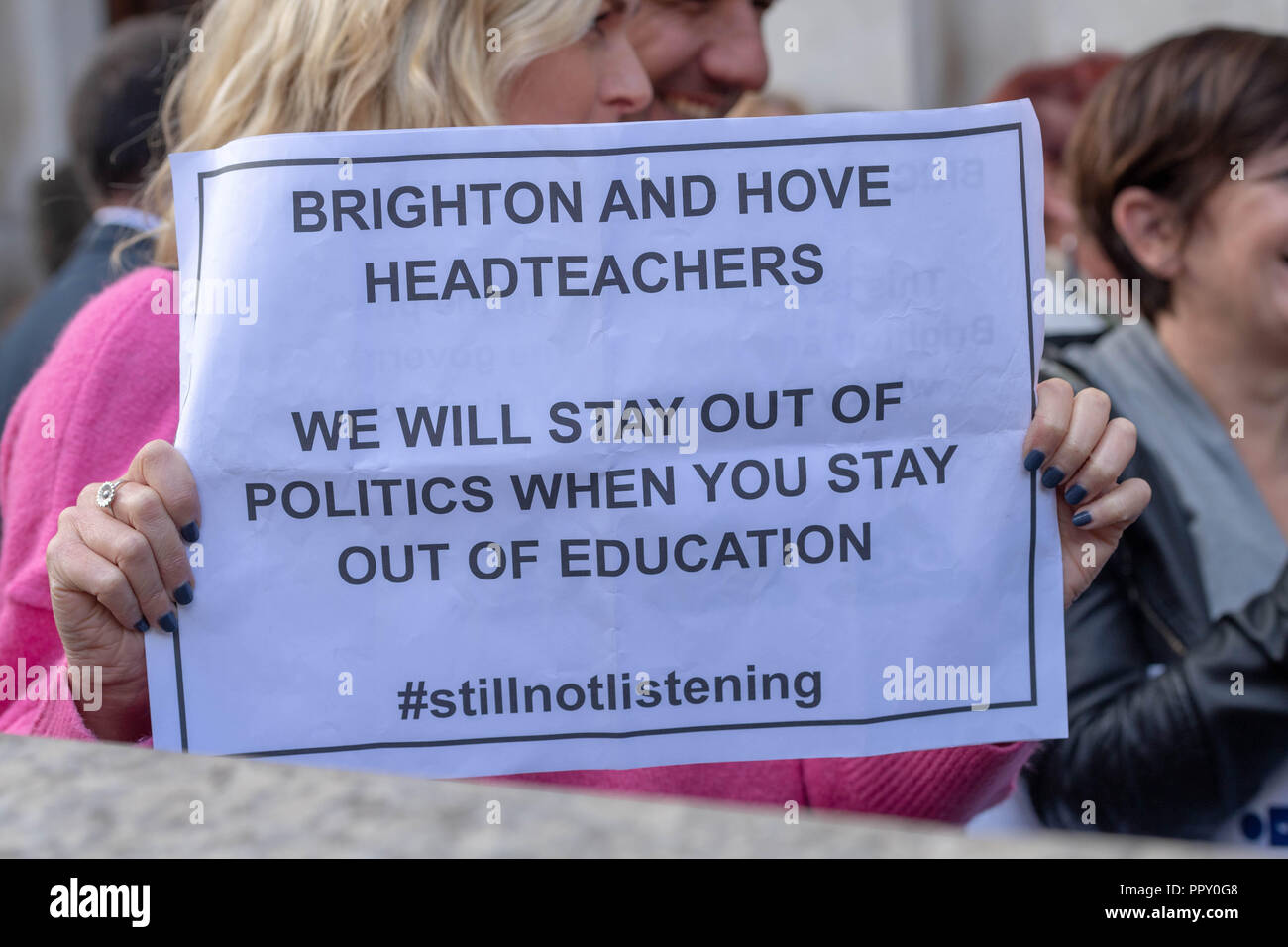 London 28th September 2018  Head Teachers rally in Westminster seeking an increase in educational funding.Hed teacher protester with banner #stillnotlistening  Credit Ian Davidson/Alamy Live News Stock Photo