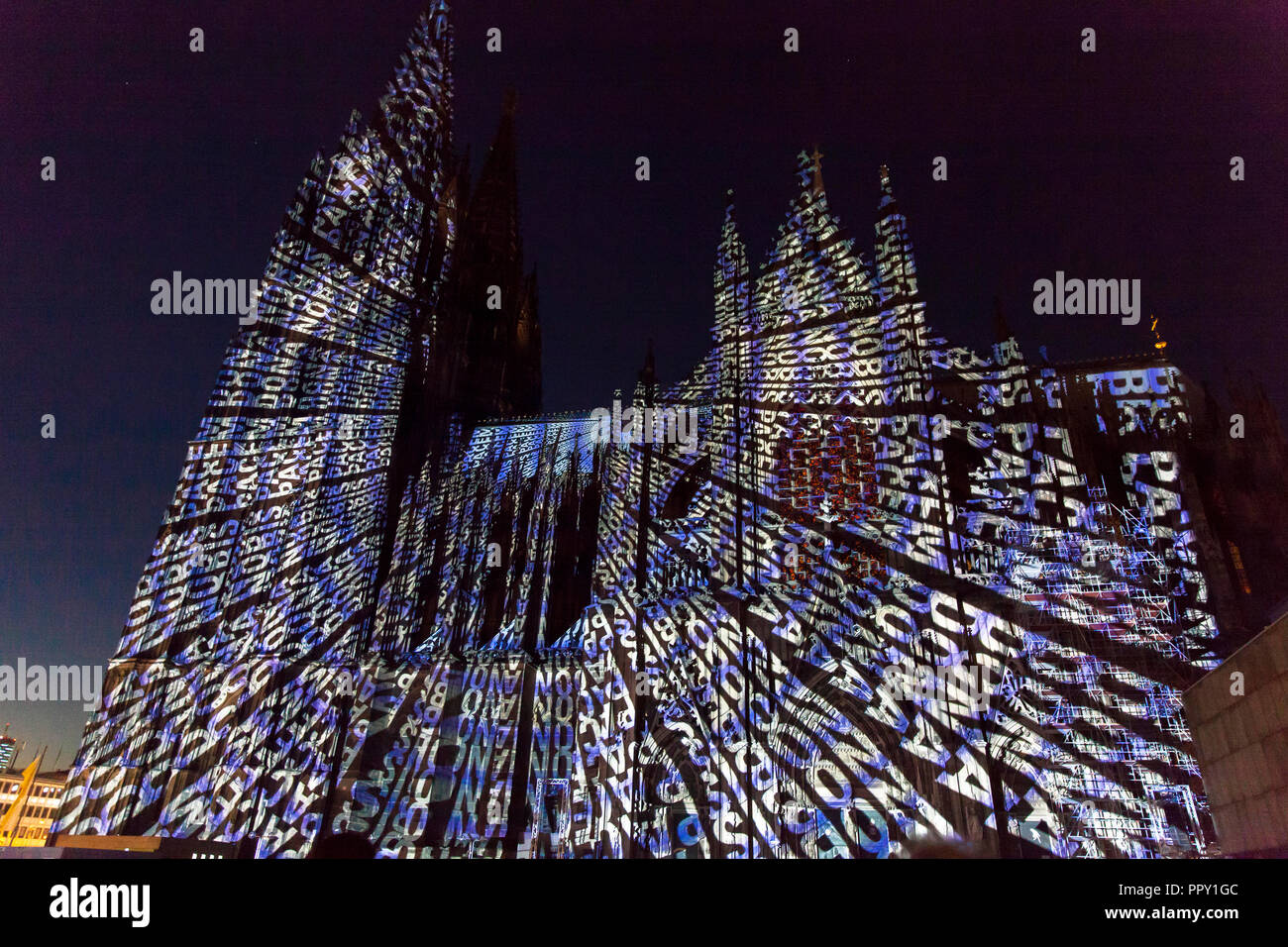 Cologne, Germany, September 27th. 2018. evening illumination of the cathedral during the cathedral pilgrimage 2018. This is a reminder of the end of World War I 100 years ago. Moving light projections by the artists Detlef Hartung and Georg Trenz on the south facade tell of the futility of war. Stock Photo