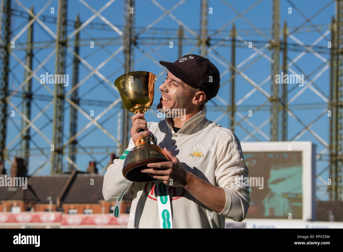 London, UK. 27 September 2018. Surrey captain Rory Burns prepares to Kiss the cup as Surrey County Cricket Club are crowned Specsavers County Champions in presentation at the Oval. David Rowe/Alamy Live News. Stock Photo