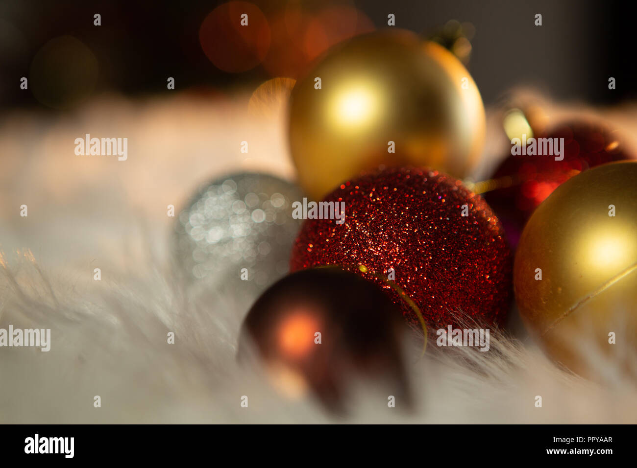 Colored Christmas ornaments on a carpet Stock Photo