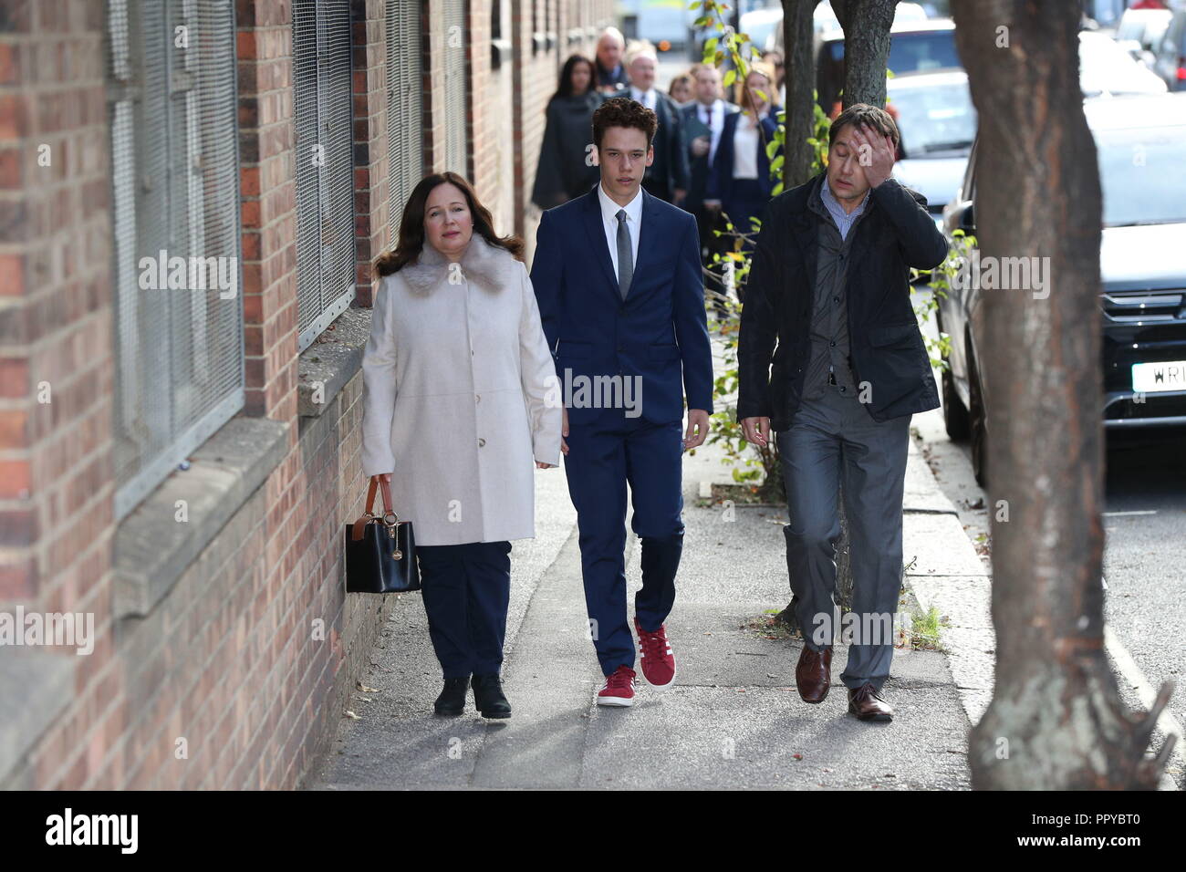 Tanya and Nadim Ednan-Laperouse, with their son Alex, outside West London  Coroners Court, arriving for the conclusion of the inquest into the death  of Natasha Ednan-Laperouse, 15, from Fulham, who died after