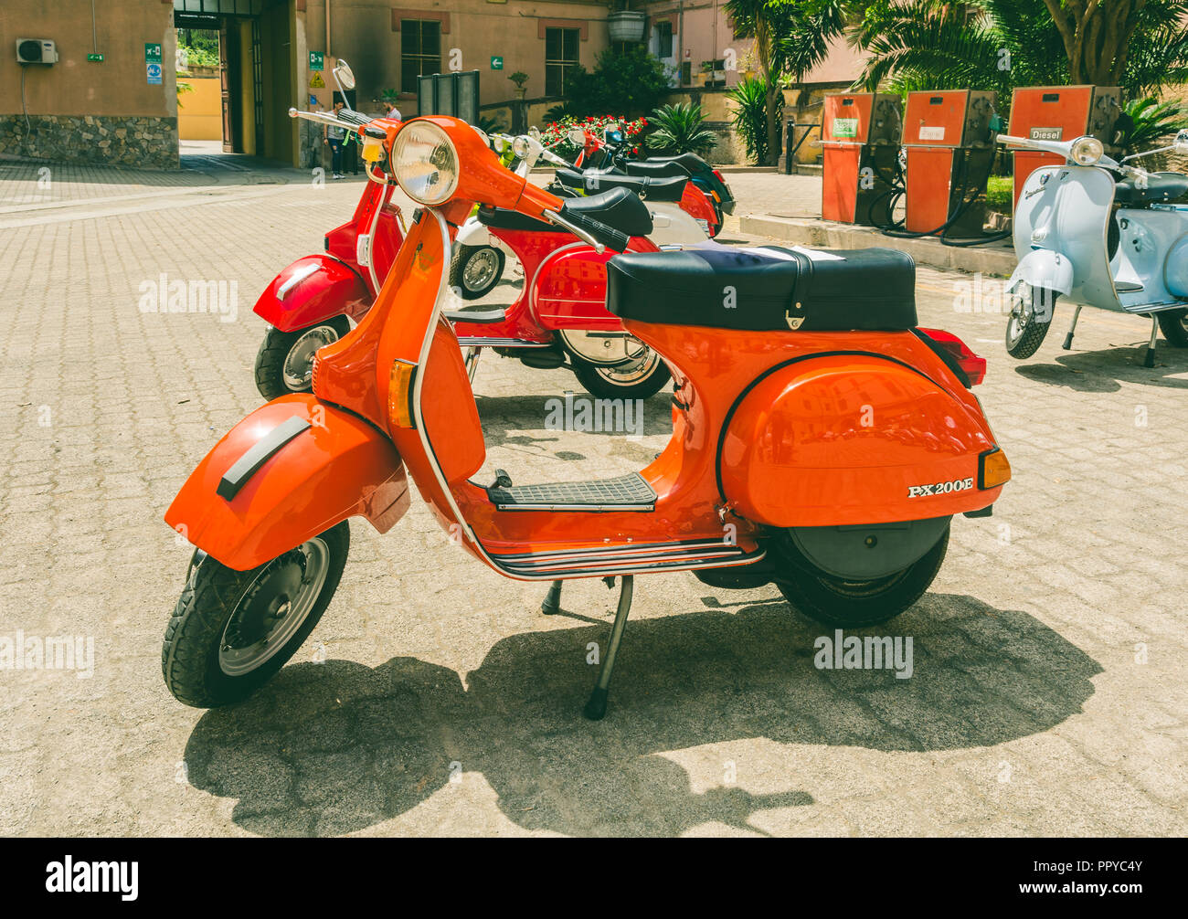 Cagliari, Italy - April 29, 2018: Piaggio Vespa vintage scooters meeting. Vintage red Vespa from the 50s. Post process in vintage styl Stock Photo