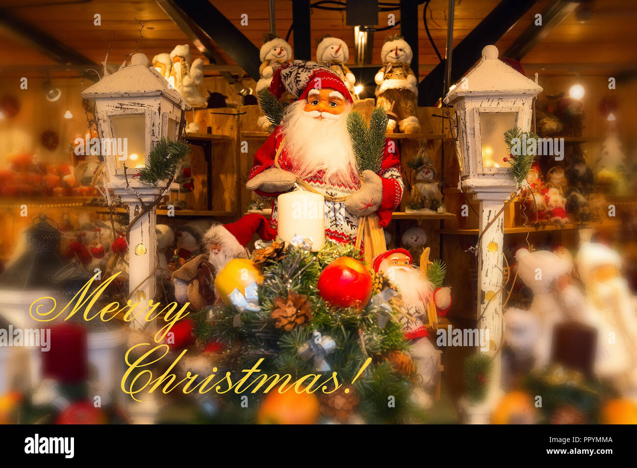 Merry Christmas postcard with Santa Claus figurine and Christmas tree, gifts Stock Photo