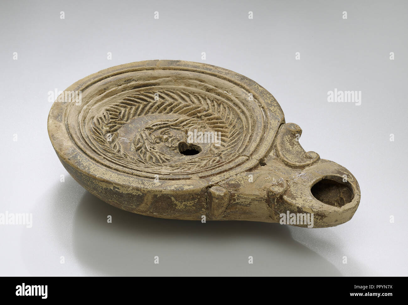 Lamp, North Africa; 1st - 4th century; Terracotta; 2.6 x 2.5 x 10.5 cm, 1 x 1 x 4 1,8 in Stock Photo