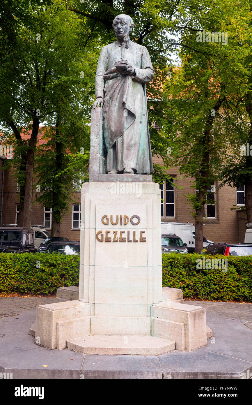 Statue of Guido Pieter Theodorus Josephus Gezelle, influential writer and poet and a Roman Catholic priest - Bruges, Belgium Stock Photo