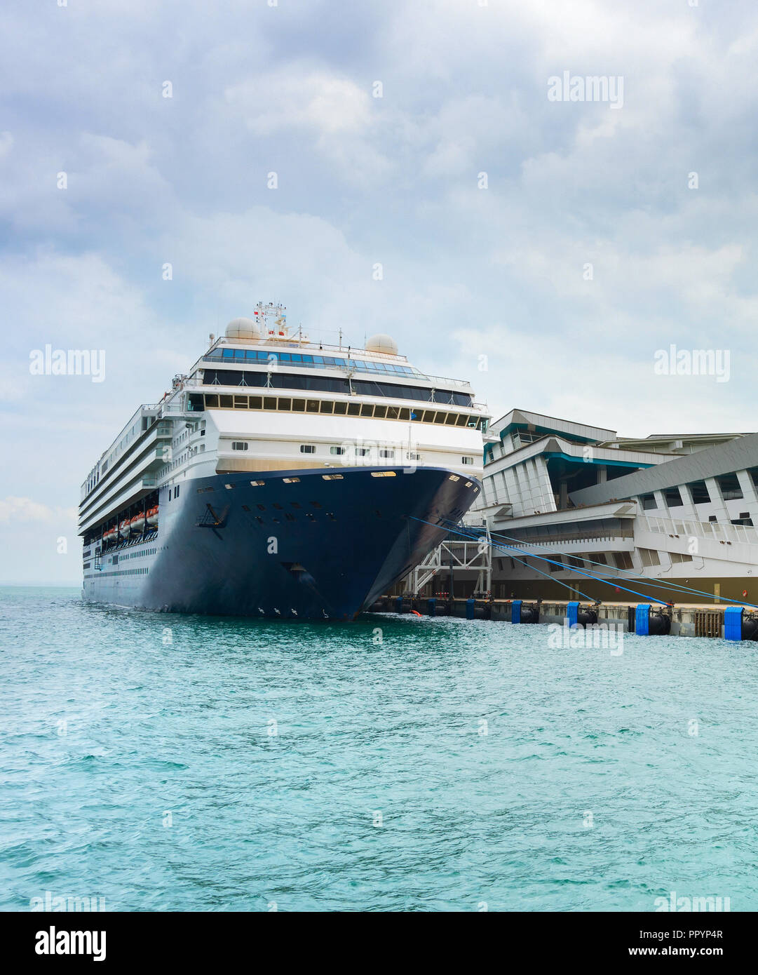 Luxury cruise ship at a passenger terminal in Singapore Stock Photo