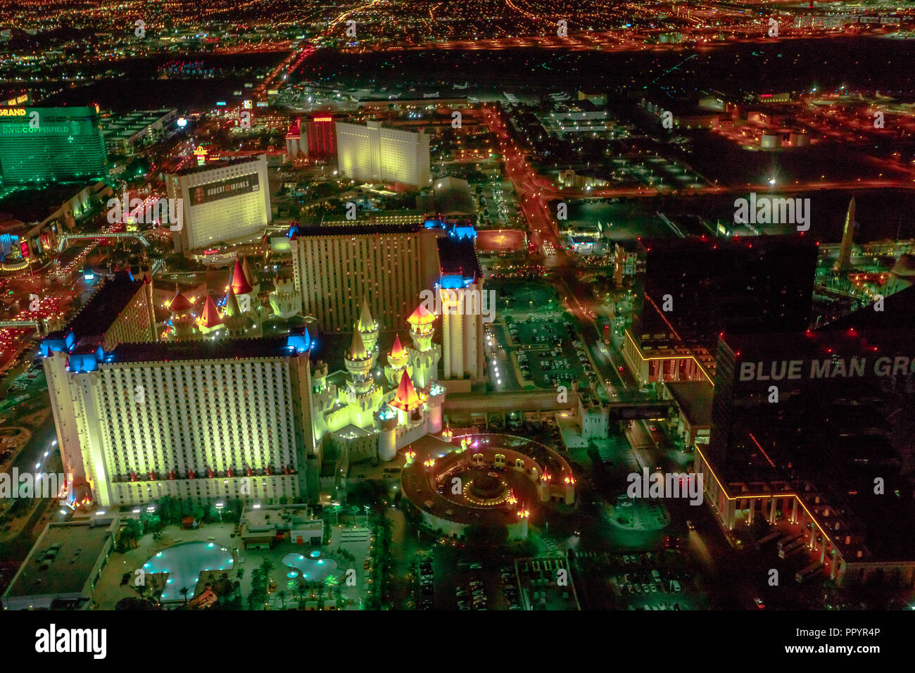 Las Vegas, Nevada, United States - August 18, 2018: aerial view of Las Vegas Strip Skyline illuminated by night. Scenic flight above: Excalibur Las Vegas Hotel and Casino, MGM Grand and Luxor Tower. Stock Photo