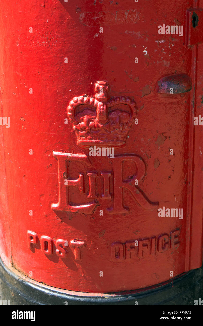 Red Pillar Box in Stansted Abbots, Hertfordshire England, showing the ER insignia. Stock Photo