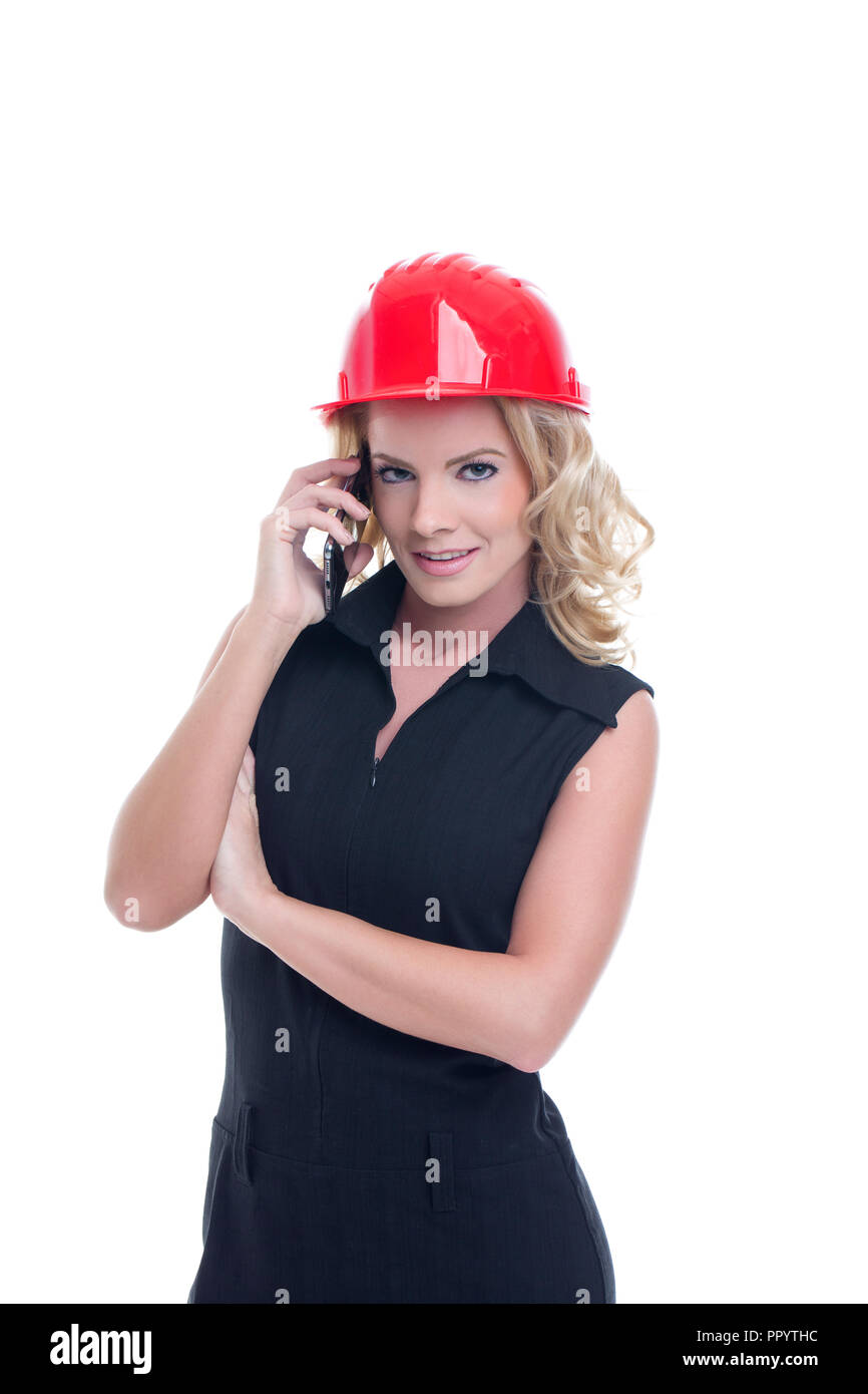 Young engineer woman in red helmet calling isolated on white Stock ...