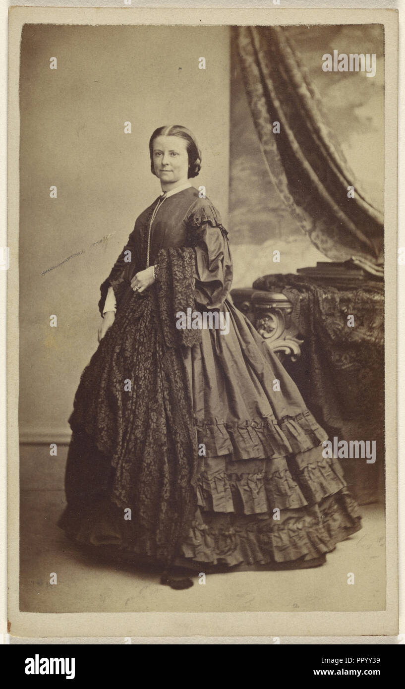 woman wearing a long dark dress, standing; Thomas Rodger, Scottish, 1832 - 1883, 1865 - 1870; Albumen silver print Stock Photo