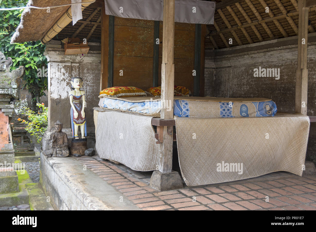 Traditional Balinese home showing large double bed for sleeping outdoors. Stock Photo
