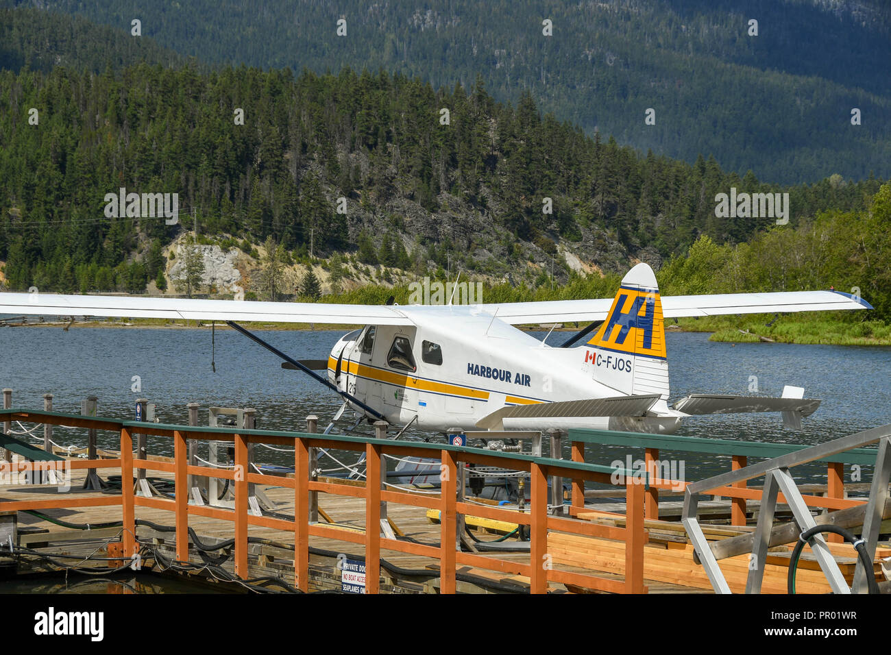 WHISTLER, BC, CANADA - JUNE 2018: Harbour Air De Havilland Beaver aircraft tied at the jetty of the Whistler Air seaplane terminal  at Whistler. Stock Photo