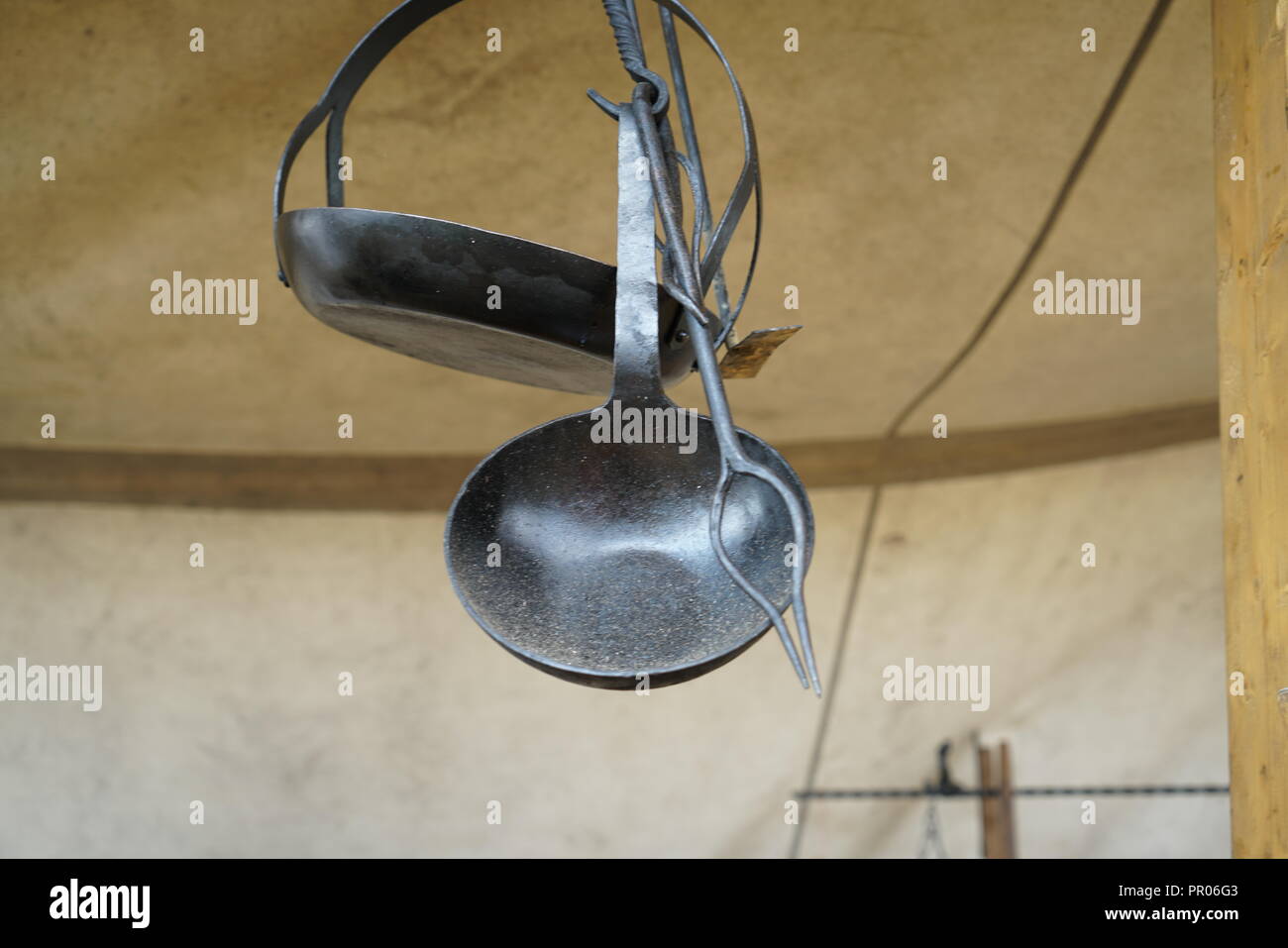 Primitive cooking on open flame with old pots and pans in Germany on a