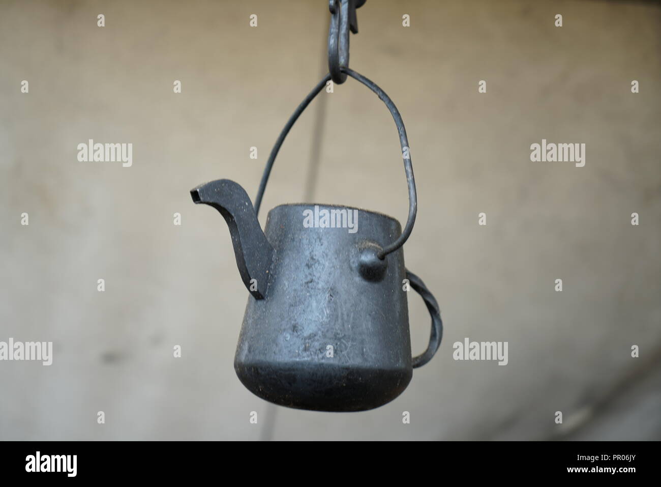 Primitive cooking on open flame with old pots and pans in Germany on a