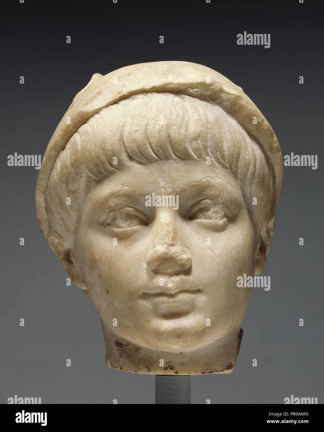 Portrait Head of a Boy as Mercury; Roman Empire; second half of 2nd century; Marble; 16 cm 6 5,16 in Stock Photo