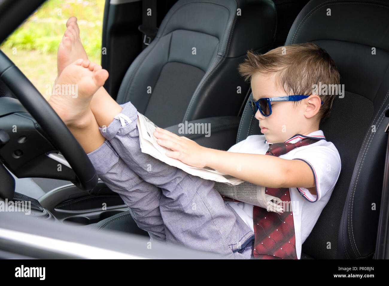 Cute driver in car Stock Photo - Alamy