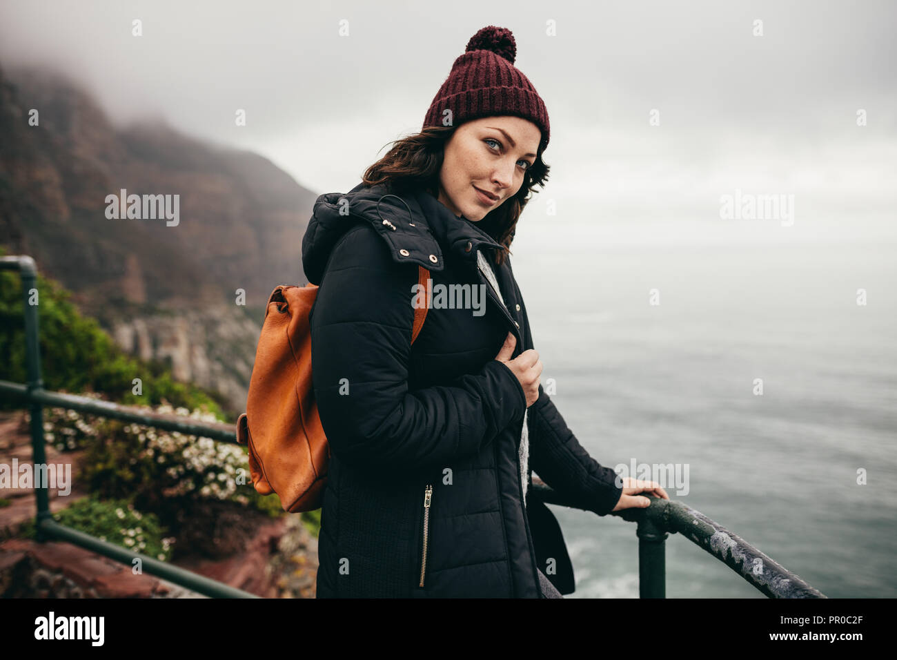 Female standing cliff top hi-res stock photography and images - Alamy