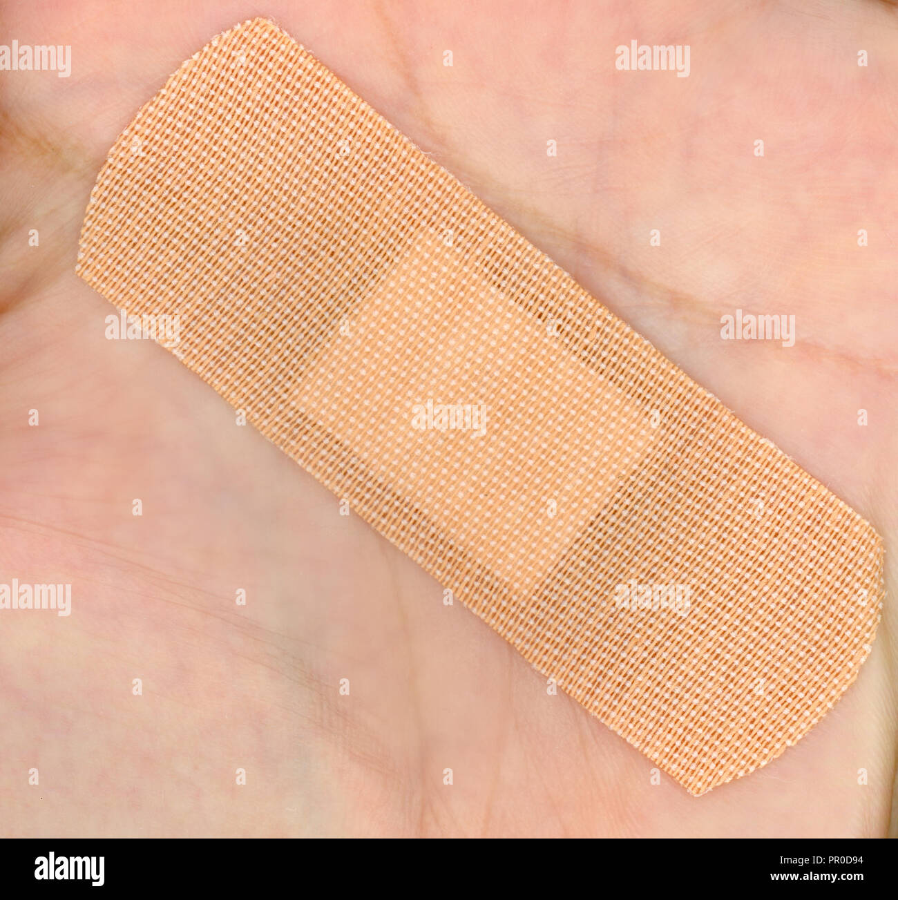 a medical self adhesive bandage band aid on hand Stock Photo Alamy