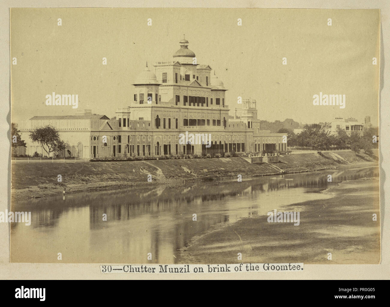 Chutter Munzil on brink of the Goomtee, The Lucknow album: containing a series of fifty photographic views of Lucknow Stock Photo