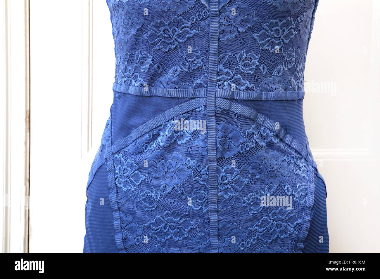 Blue Lace Sleeveless Evening Dress on Mannequin Stock Photo
