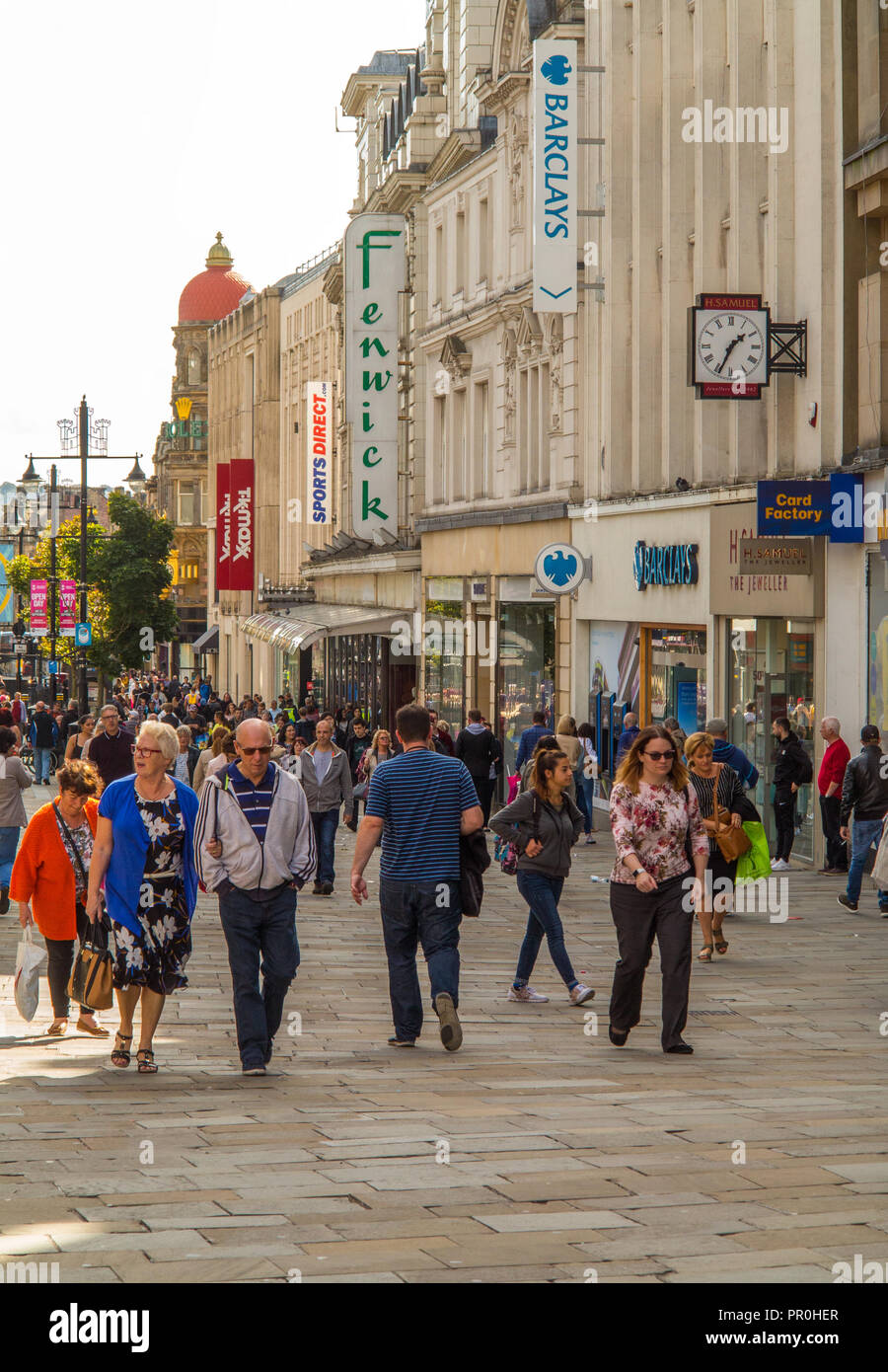 Newcastle upon Tyne city center high street busy with shoppers shopping