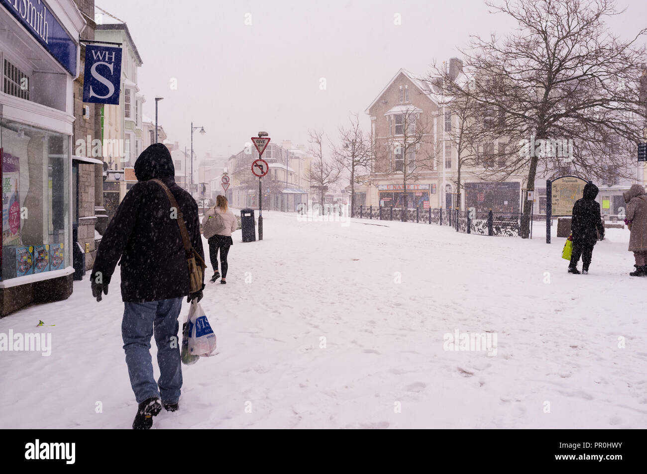 Town centre during thick snow with people. Stock Photo