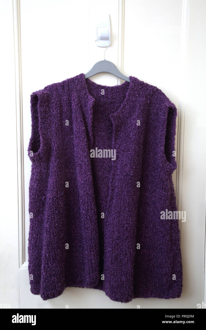 Handmade Knitted Purple Sleeveless Cardigan Stock Photo