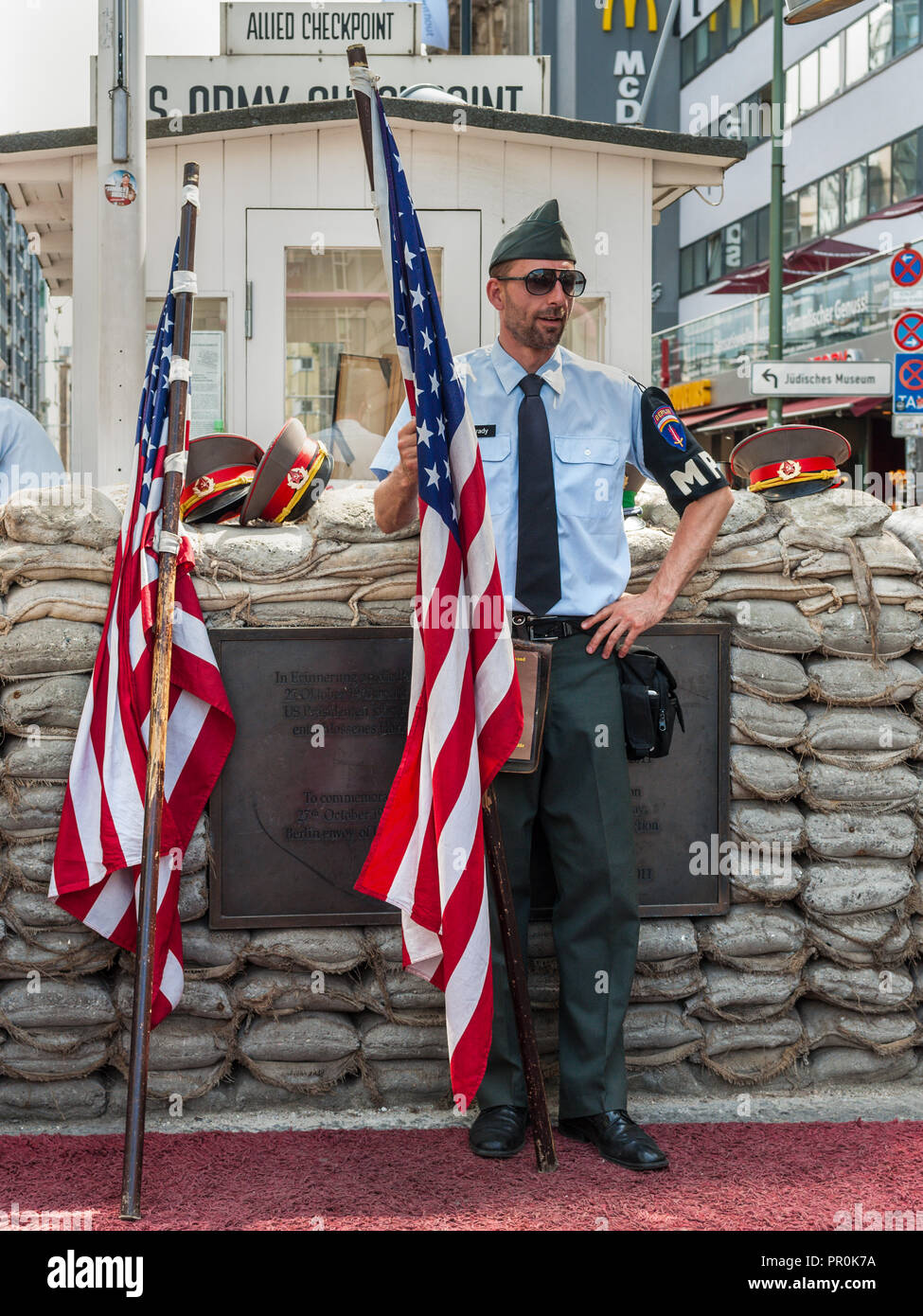 Berlin, Germany - May 28, 2017: Soldier with uniform of the military police at Checkpoint Charlie in Berlin. Checkpoint Charlie famous passage between Stock Photo