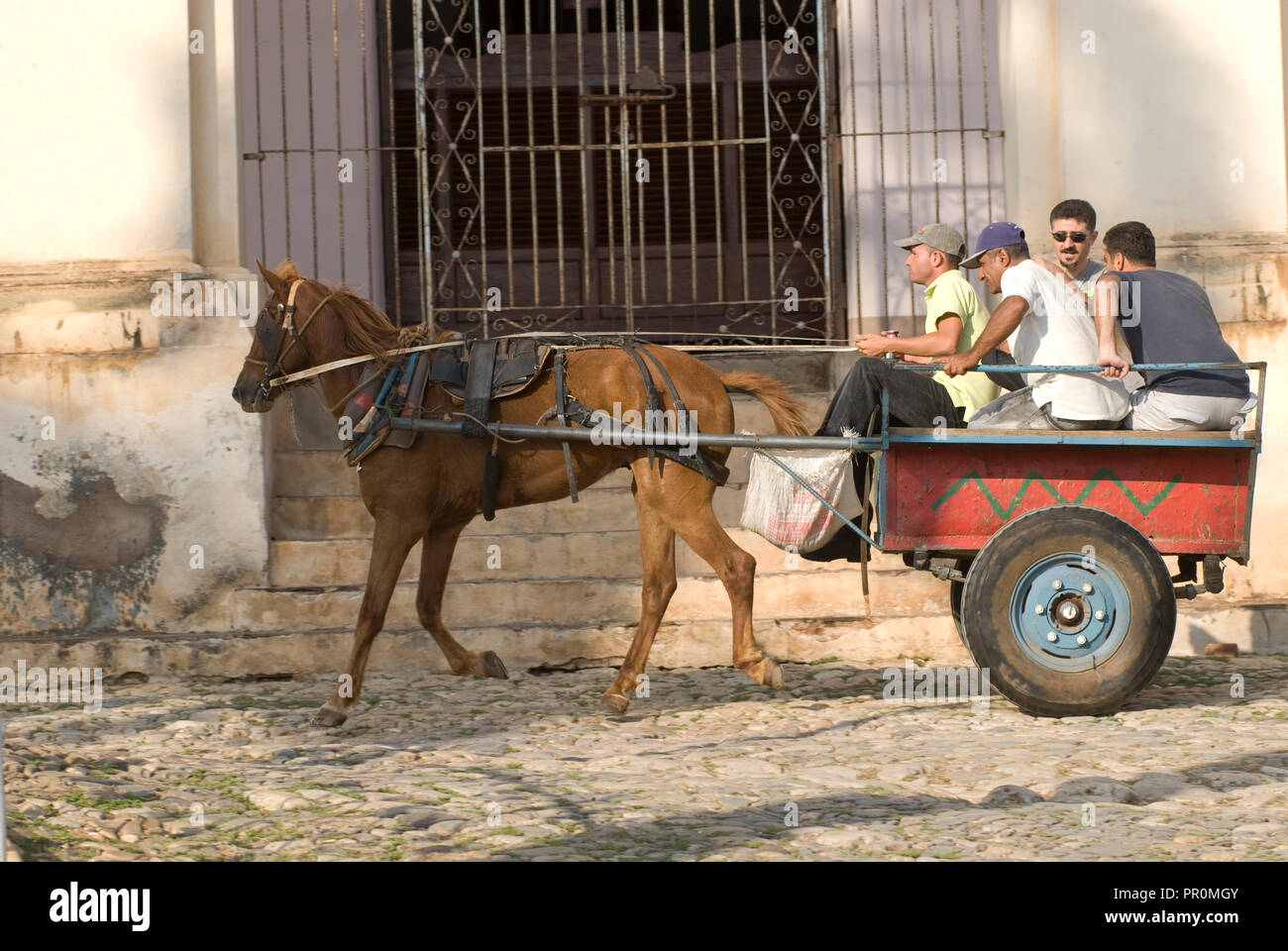 Horse and carriage loaded with locals in Trinidad Cuba Stock Photo