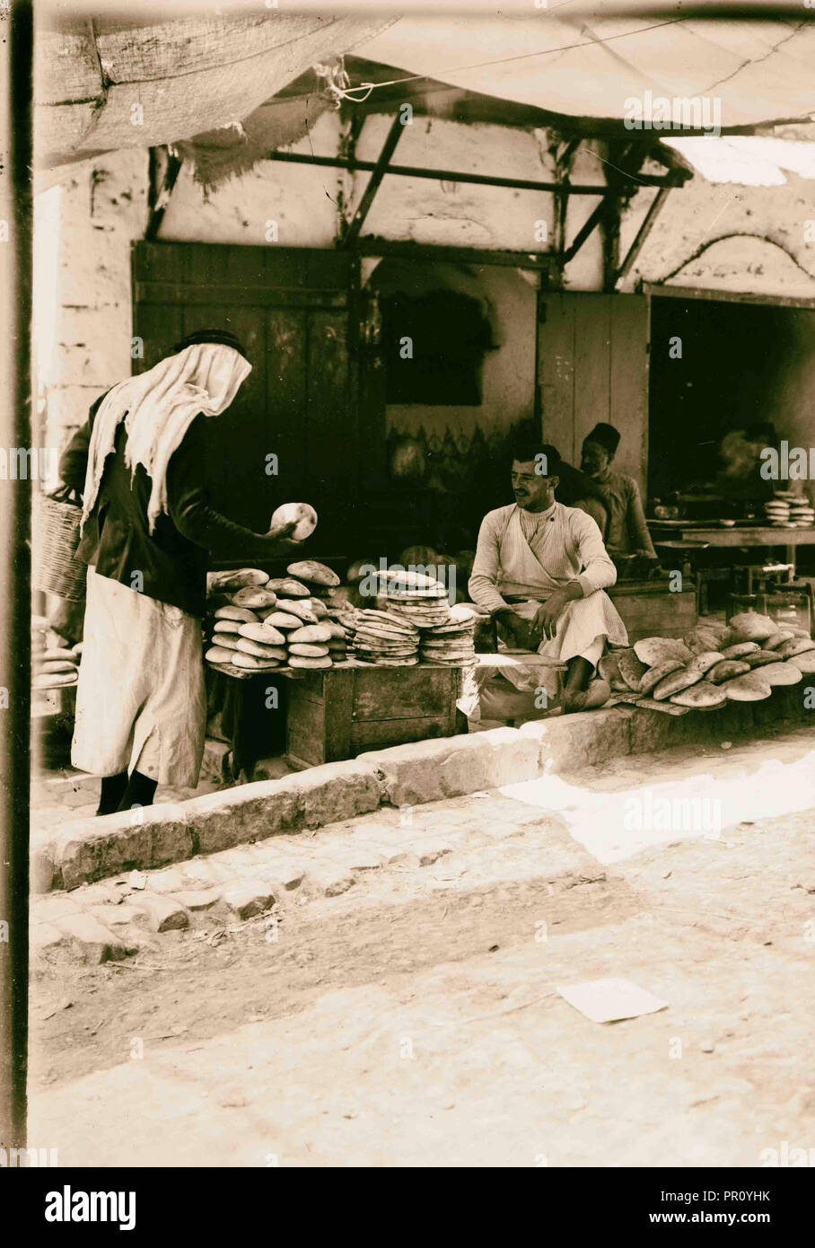 Bread vendor 1900 Middle East Stock Photo Alamy