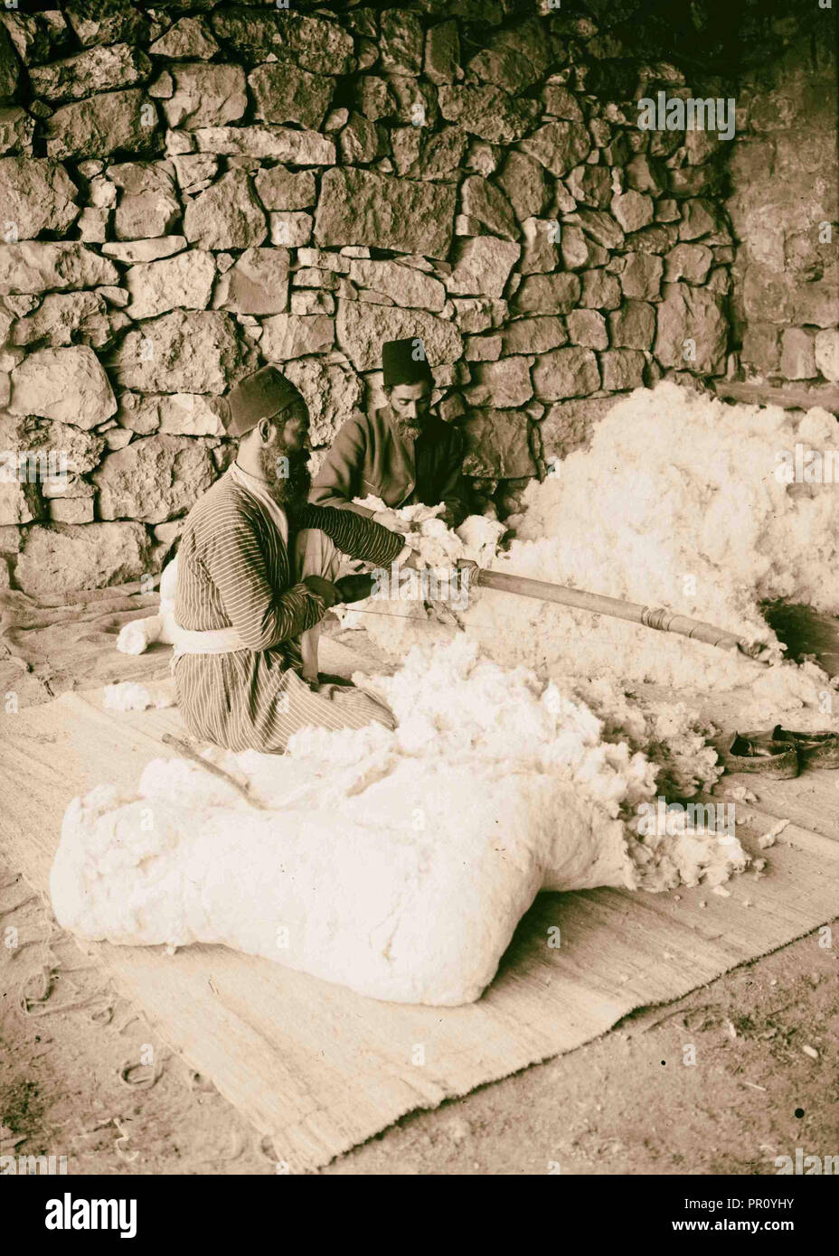 Jews carding cotton. 1900 Middle East Stock Photo Alamy