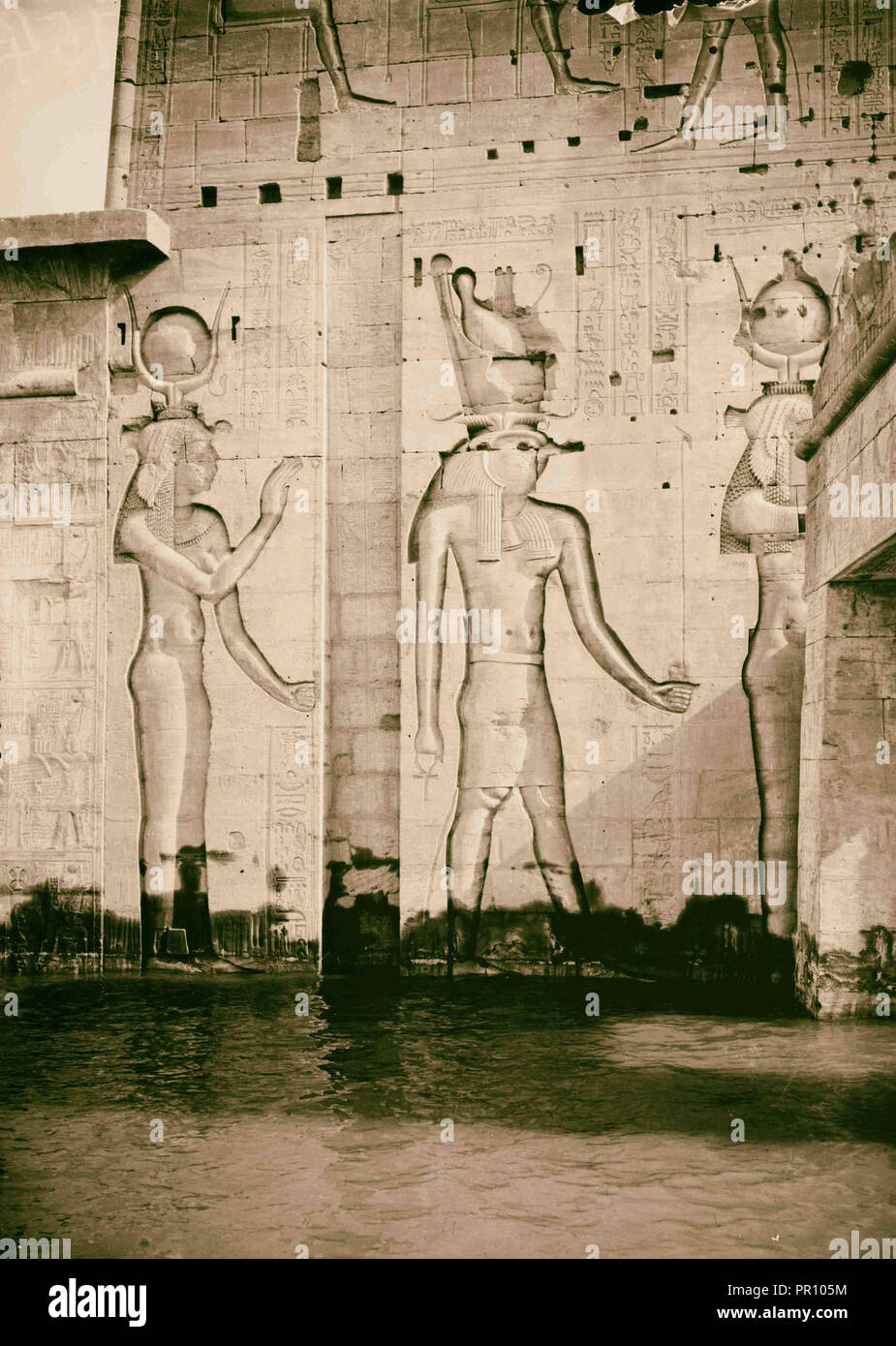 Egyptian views; Assuan and Philae. Reliefs of different deities on wing of 1st pylon. 1900, Egypt, Philae Stock Photo