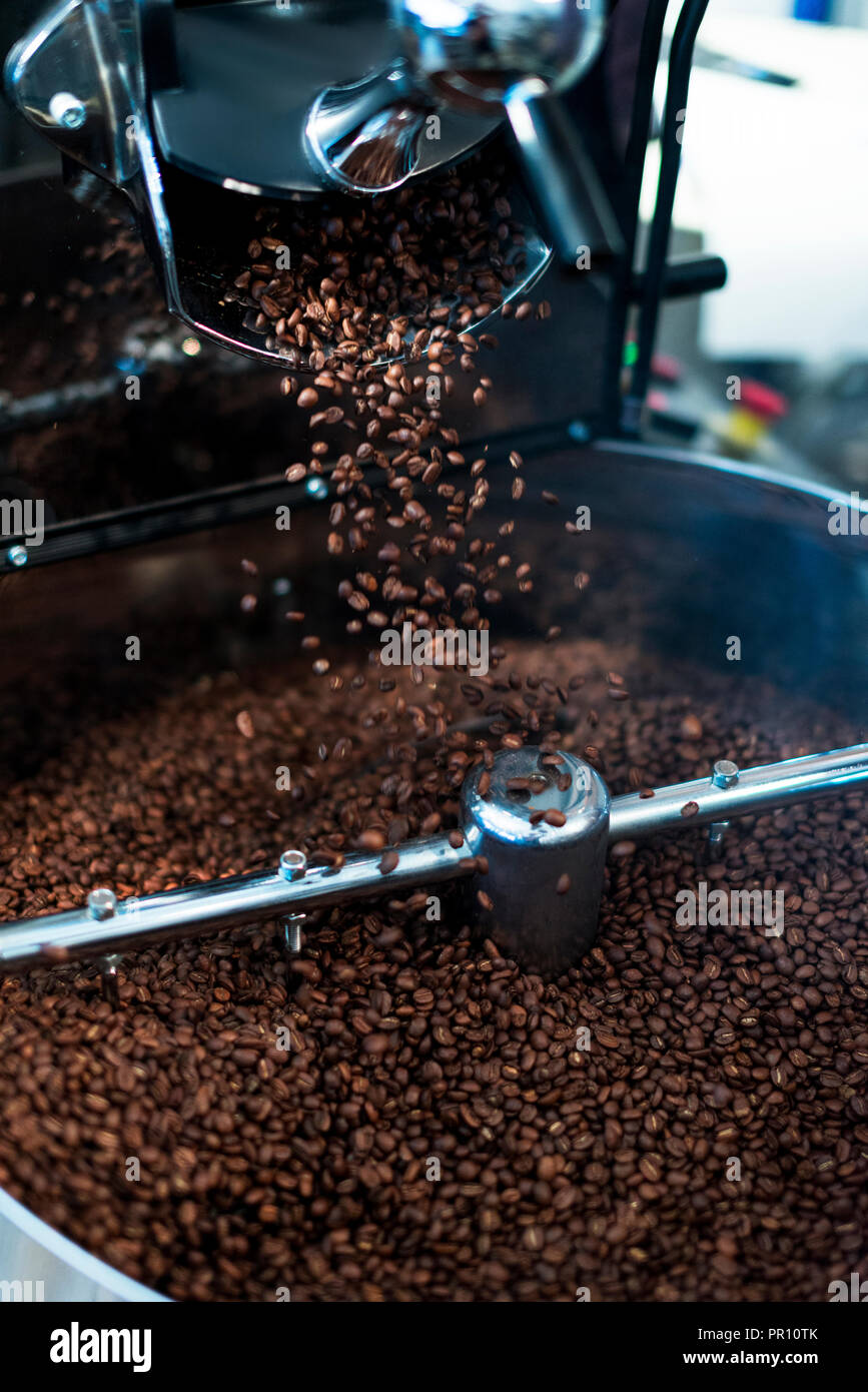 Coffee bean roasting machine. Beans are pouring Stock Photo Alamy