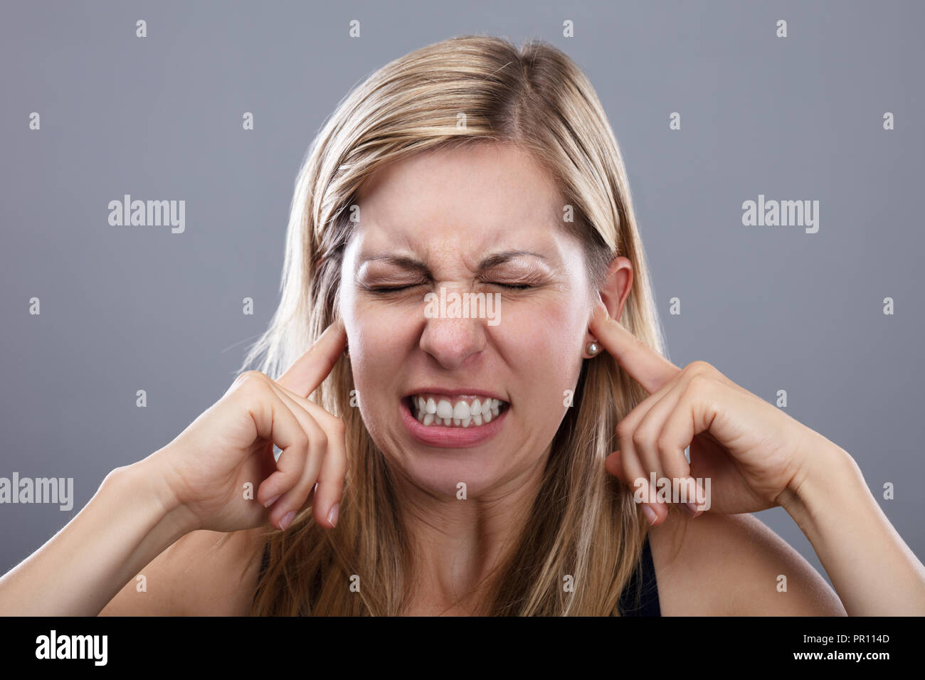 Close up woman covering ears hires stock photography and images Alamy