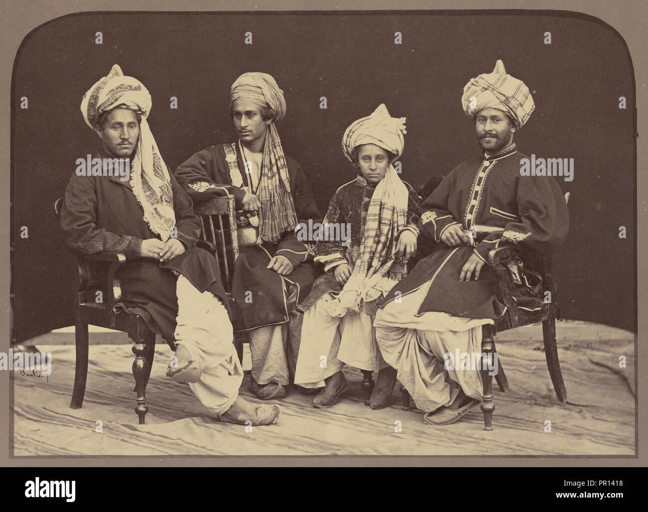 Portrait of men and boy; John Burke, British, active 1860s - 1870s, Afghanistan; 1878 - 1879; Albumen silver print Stock Photo