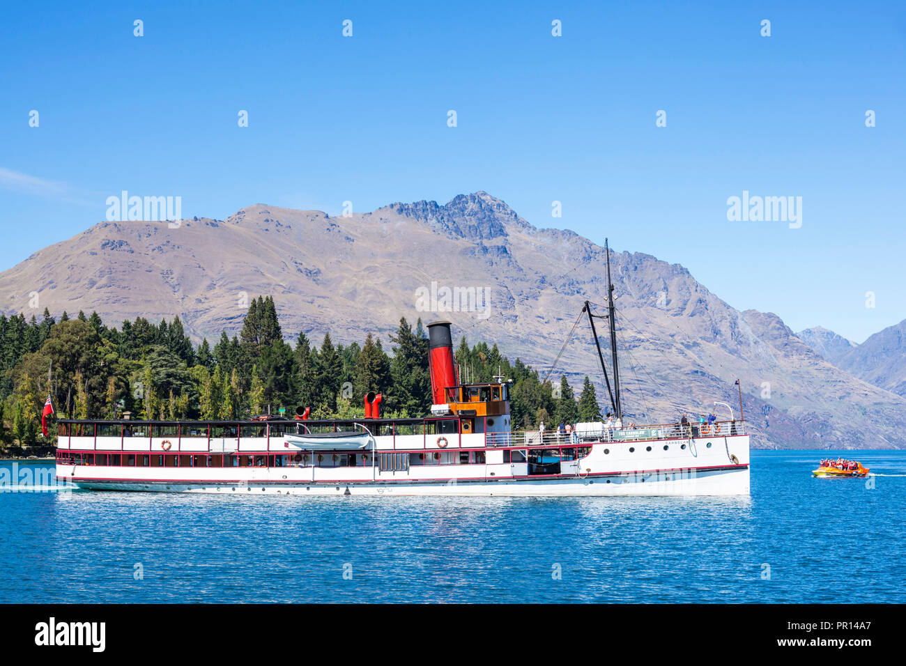 TSS Earnslaw Cruise Steamship and Cecil Peak on Lake Wakatipu, Queenstown, Otago, South Island, New Zealand, Pacific Stock Photo