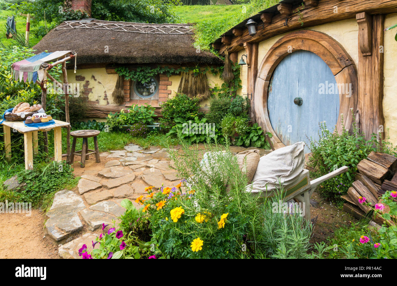 Hobbiton, wooden doors of Hobbit holes in the film set fictional village of Hobbiton, Matamata, North Island, New Zealand, Pacific Stock Photo