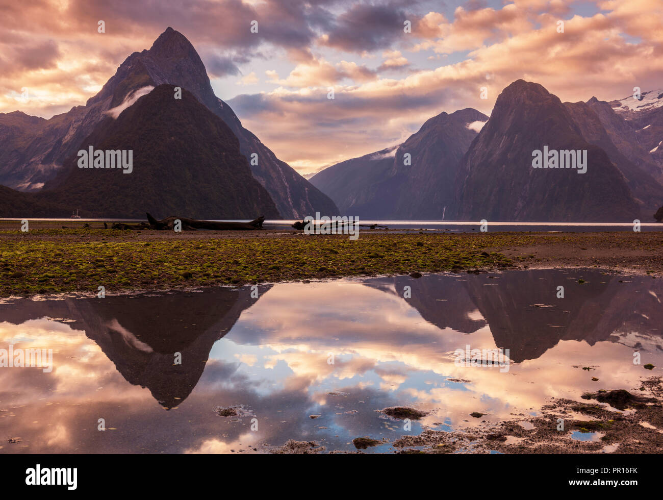 Mitre Peak and Lion Peak sunset reflections, Milford Sound, Fiordland National Park, UNESCO, Southland, South Island, New Zealand Stock Photo