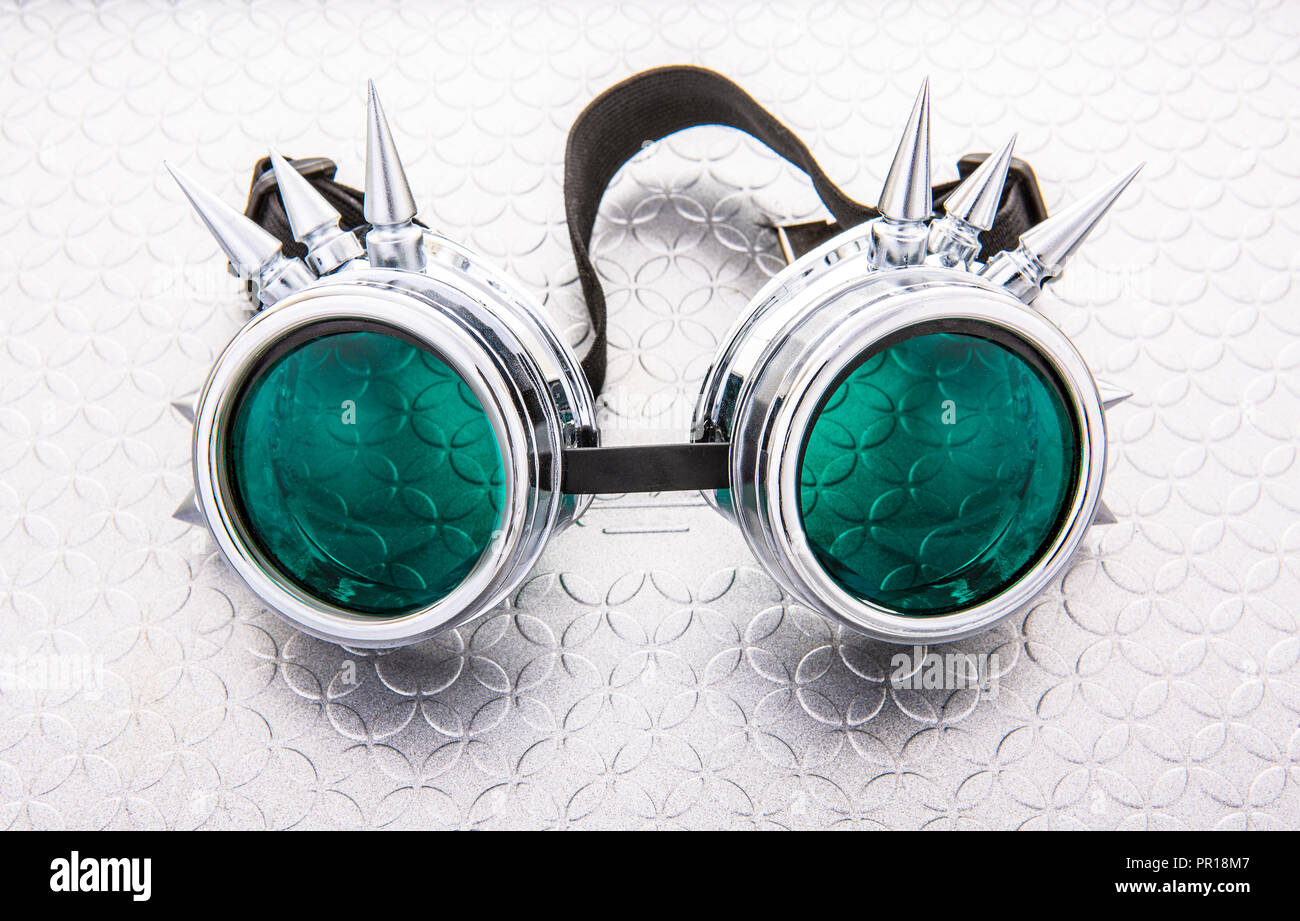 Pair of Steam Punk goggles on a silver background Stock Photo