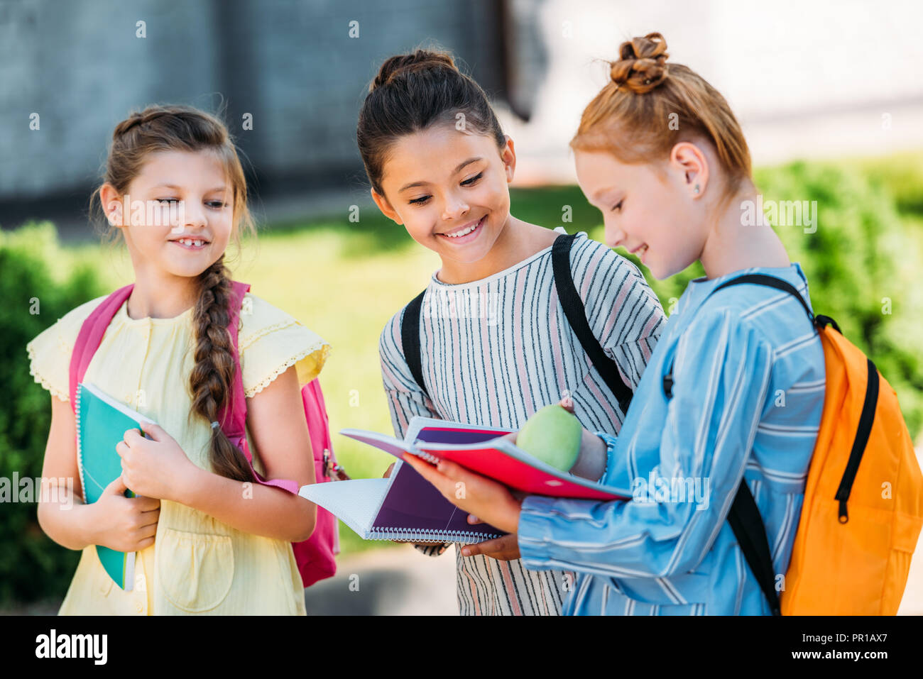 Happy schoolgirls walking hi-res stock photography and images - Alamy