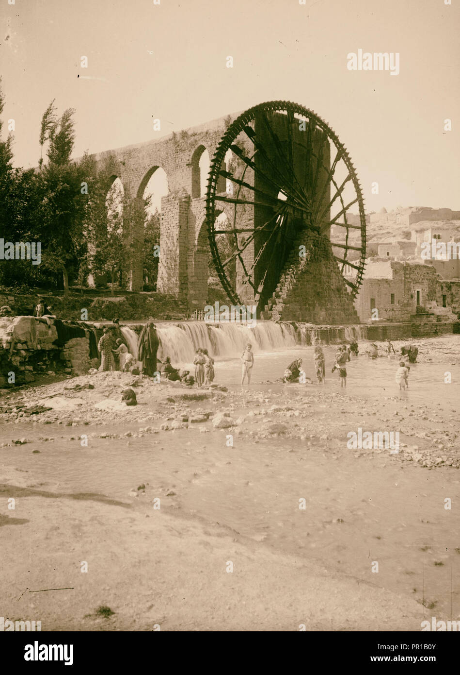 Hama (Hamath). Water-wheel and aqueduct for irrigation. 1900, Syria, Ḥamāh Stock Photo