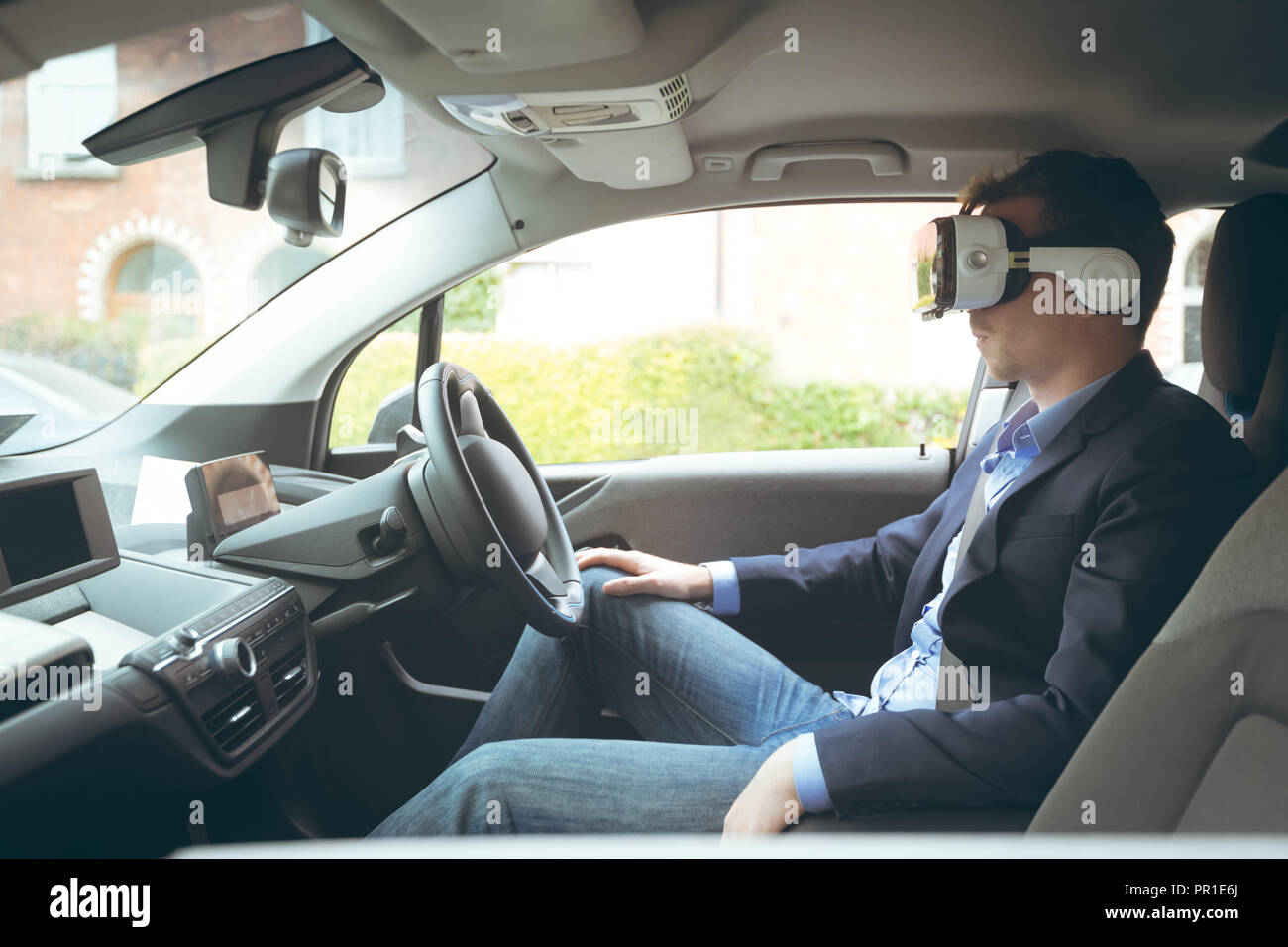 Businessman using virtual reality headset Stock Photo