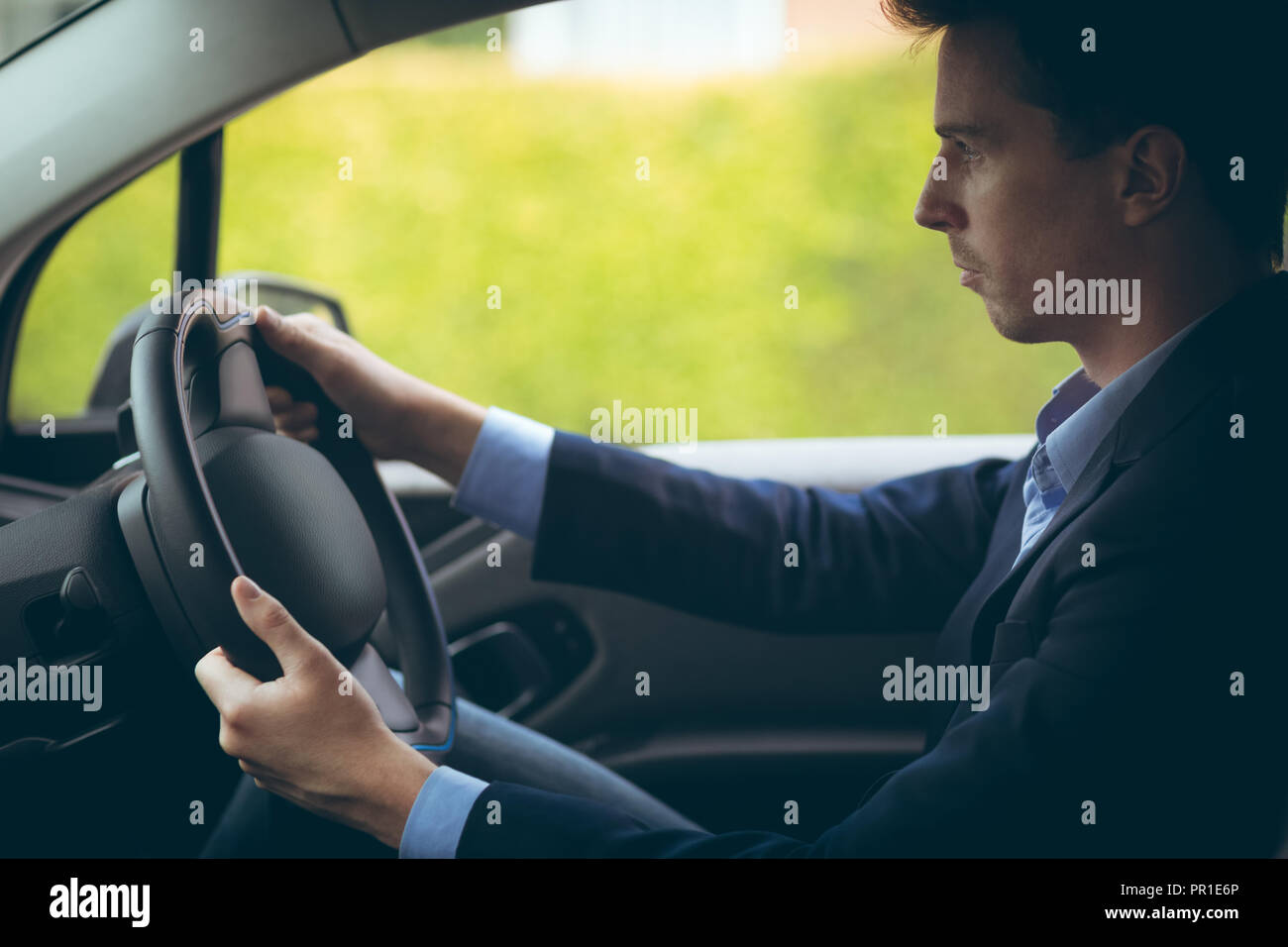 Businessman driving a car Stock Photo