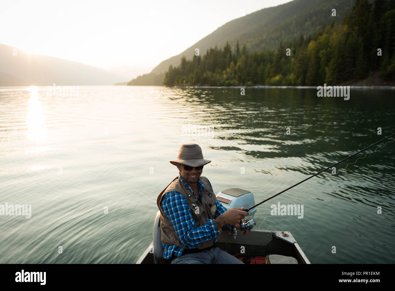Fisherman fishing in the river Stock Photo