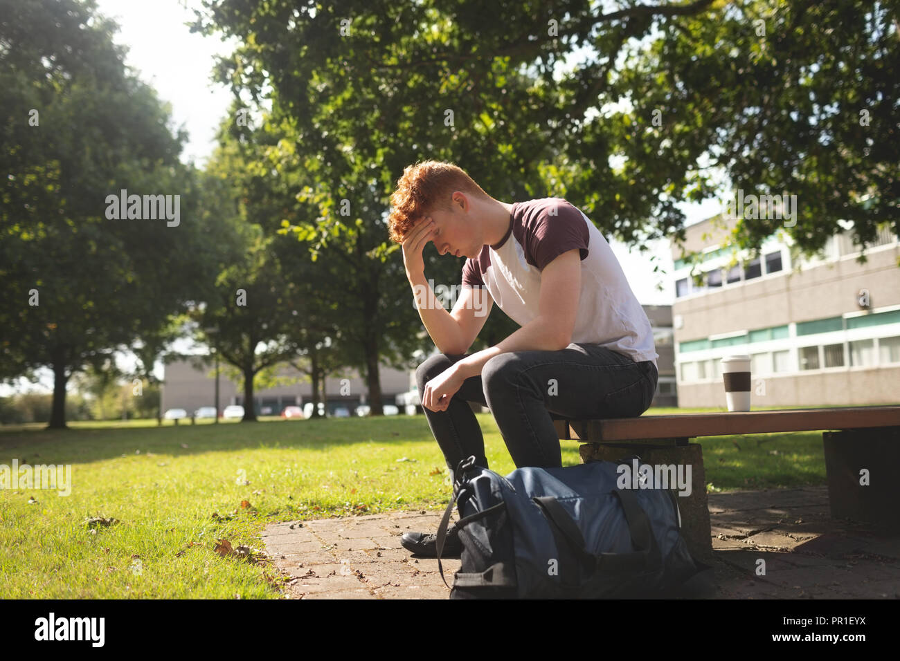 College student sitting in campus Stock Photo