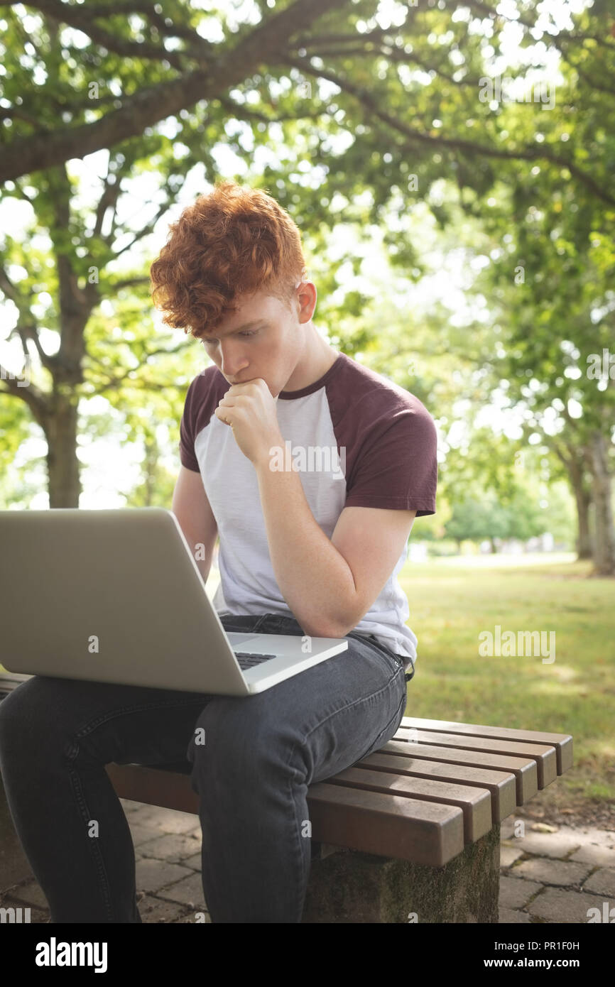 College student using laptop in campus Stock Photo